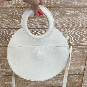 White Crossbody Bag with Circular Design and Ring Handle